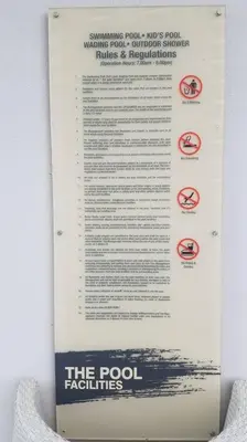 a sign on a wall that says the pool facilities at UN1 28 Jazz Massage Chair 5 min GMC Gurney \u5957\u623f in Tanjong Tokong