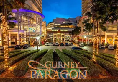 a sign that reads gimney paragon in a parking lot at UN1 28 Jazz Massage Chair 5 min GMC Gurney \u5957\u623f in Tanjong Tokong