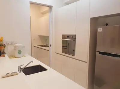 a white kitchen with a sink and a refrigerator at UN1 28 Jazz Massage Chair 5 min GMC Gurney \u5957\u623f in Tanjong Tokong