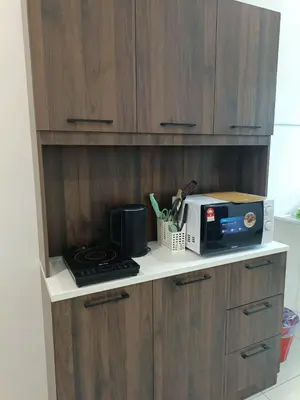 a kitchen counter with a toaster and a microwave at Cozy 4 bedrooms House by Mr Homestay, 3 mins to Kulim Landmark Centre in Kulim