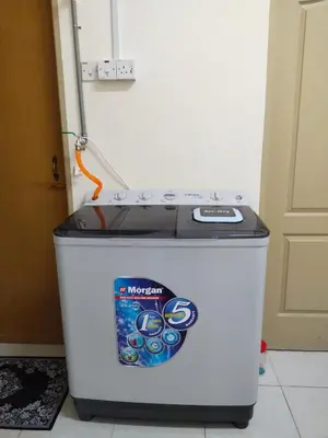 a small refrigerator with a sticker on the top of it at WAFID HOMESTAY 2 SERI ISKANDAR in Seri Iskandar