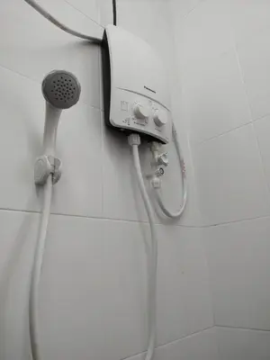 a shower in a bathroom with a shower head at WAFID HOMESTAY 2 SERI ISKANDAR in Seri Iskandar