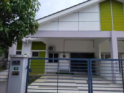 a building with a gate in front of it at WAFID HOMESTAY 2 SERI ISKANDAR in Seri Iskandar