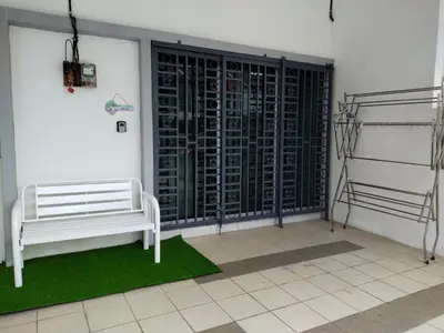 a room with a white bench and a wall of wine racks at WAFID HOMESTAY 2 SERI ISKANDAR in Seri Iskandar