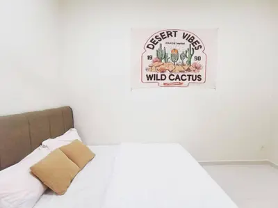 a bedroom with a bed with a sign on the wall at Ipoh stadium-18 pax (mahjong/5min to town) pets friendly in Ipoh