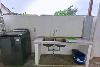 a sink and a trash can next to a wall at Ipoh stadium-18 pax (mahjong/5min to town) pets friendly in Ipoh