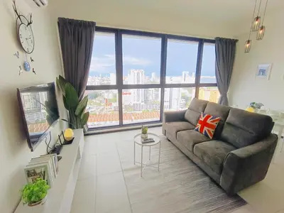 a living room with a couch and a large window at Infinity Pool, Georgetown, Up to 11 Pax, 2 Bedrooms, 2 Bathrooms, 2 Car Parks by Star Home in Jelutong