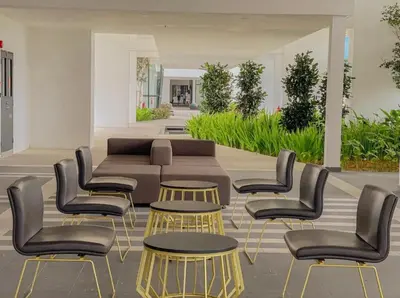 a group of chairs and tables in a room at Infinity Pool, Georgetown, Up to 11 Pax, 2 Bedrooms, 2 Bathrooms, 2 Car Parks by Star Home in Jelutong