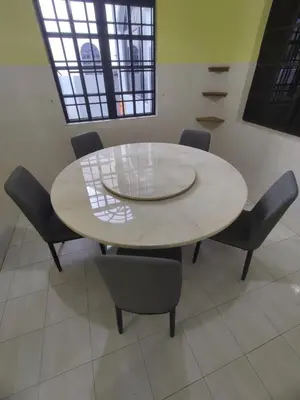 a white table and chairs in a room at Ipoh Tambun Sunway 5 Rooms Spacious Homestay in Tambun
