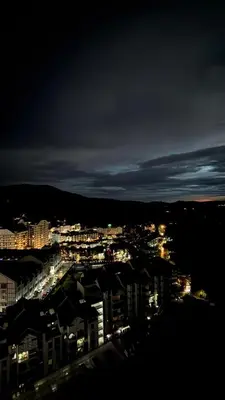 a view of a city at night with lights at CRYSTAL D CAMERON HOMESTAY in Cameron Highlands