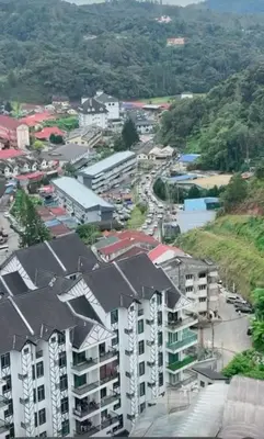 an aerial view of a city with buildings and a street at CRYSTAL D CAMERON HOMESTAY in Cameron Highlands