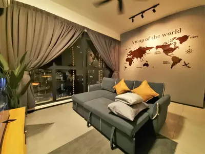 a living room with a couch and a map of the world at Modern Elegance Suite, 5 to 6 pax at Urban Suites Georgetown by SuperStay in Jelutong