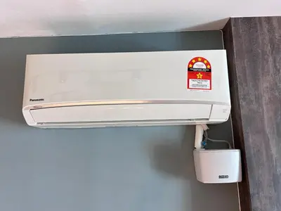 a white printer sitting on top of a wall at Seaview Mansion One 2R2B George Town Gleneagles Gurney Komtar by Cozy Cottage Haven in George Town