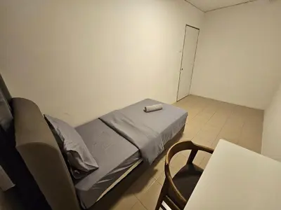 a hospital room with a bed and a table at SS HOSTEL PENANG in George Town