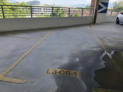 a parking lot with a sign on the ground at Adinda Homestay @ RPB Hospital, Ipoh in Ipoh