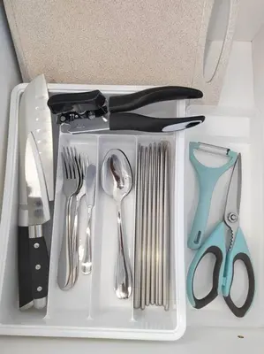 a plastic tray with utensils in a drawer at Seaview Infinity Pool #6pax #2bedroom #2bathroom in Jelutong