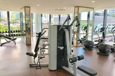 a gym with treadmills and exercise equipment in a building at Deluxe Seaview Suite Twin Bed by The Only Bnb in Tanjong Tokong