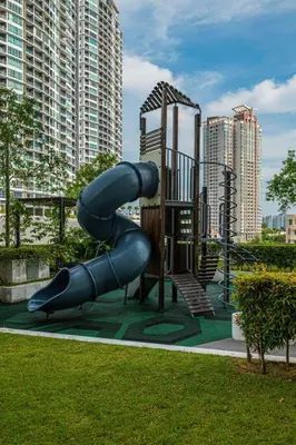 a playground with a slide in a city at Deluxe Seaview Suite Twin Bed by The Only Bnb in Tanjong Tokong