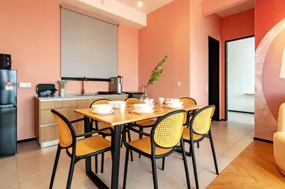 a dining room with a table and chairs at Urban Suites, Signature Collection by Stellar ALV in Jelutong