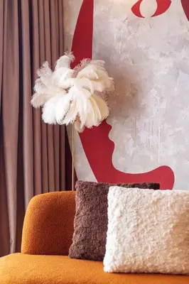 a pillow sitting on a chair with aumedumed head at Urban Suites, Signature Collection by Stellar ALV in Jelutong