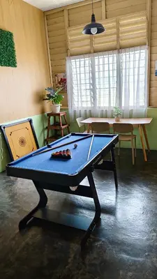 a ping pong table in a room with a table at Grandpa House \u7237\u7237\u8001\u5bb6 in Gopeng