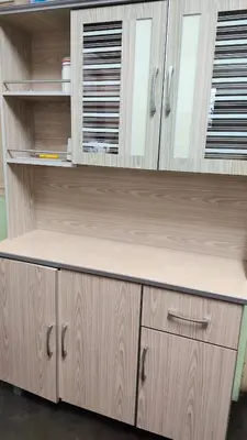 a desk in a kitchen with wooden cabinets at Grandpa House \u7237\u7237\u8001\u5bb6 in Gopeng