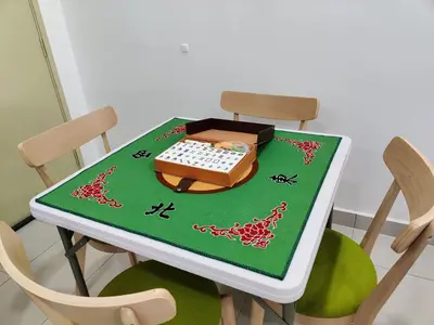 a table with a cake on top of it at Hygge Living Kampar II (Near UTAR) in Kampar