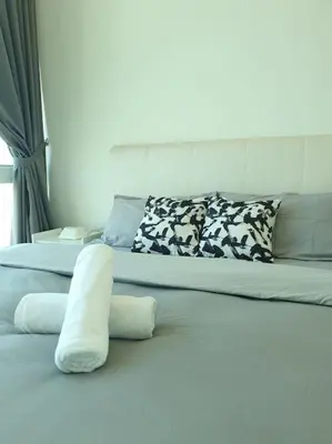 a large white bed with pillows on it at Southbay Seaview Condo A11 #Queensbay #SPICE in Bayan Lepas