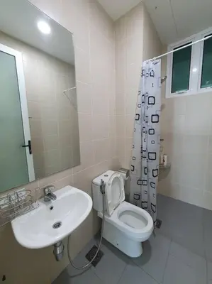a white bathroom with a sink and a toilet at Southbay Seaview Condo A11 #Queensbay #SPICE in Bayan Lepas