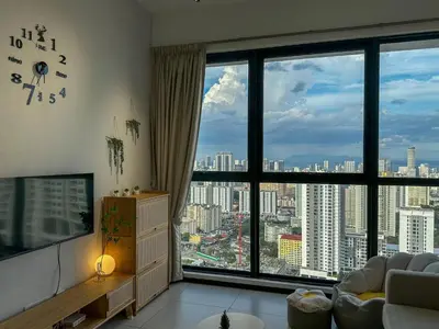 a living room with a view of a city at Cozy Urban Suites Georgetown View by 3C in Jelutong