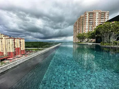 a large pool of water in the middle of a city at Cozy Urban Suites Georgetown View by 3C in Jelutong