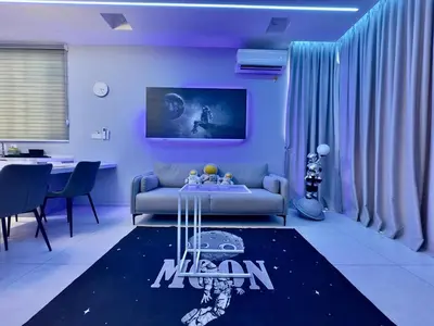 a living room with a couch and a table at Cozy Urban Suites Georgetown View by 3C in Jelutong