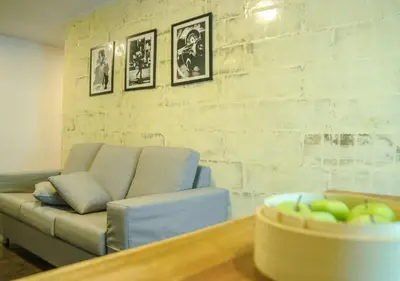 a living room with a couch and a table at Hotel Regal Vista in Ipoh