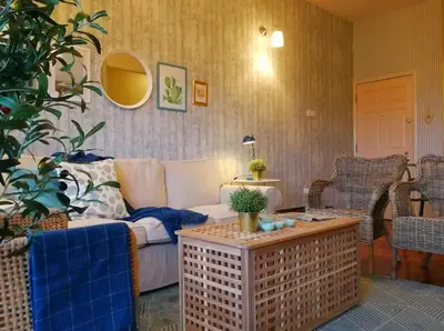 a living room with a couch and a table at Green Hill Tanah Rata Cameron Highland in Tanah Rata