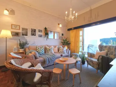 a living room with a couch and chairs at Green Hill Tanah Rata Cameron Highland in Tanah Rata