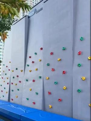 a climbing wall with umbrellas on a wall at Veneto Penang homestay 3BR with infinity pool in Jelutong