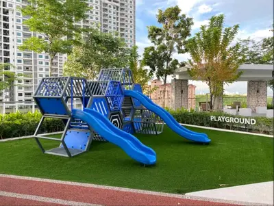 a playground with a blue slide in a park at Veneto Penang homestay 3BR with infinity pool in Jelutong