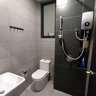 a bathroom with a white toilet and a sink at Veneto Penang homestay 3BR with infinity pool in Jelutong