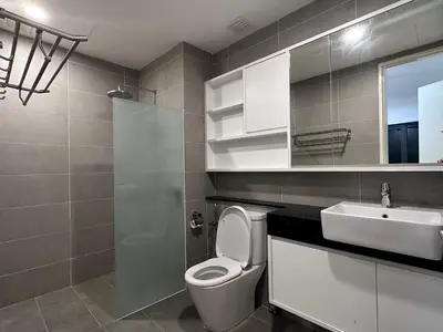 a bathroom with a toilet and a sink at Tropicana 218 Macalister WL in George Town