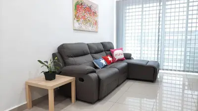 a black couch in a living room with a table at THE MAJESTIC IPOH B7 by ZamanJa in Ipoh