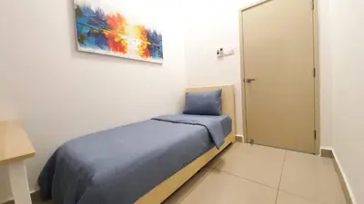 a bedroom with a bed and a painting on the wall at THE MAJESTIC IPOH B7 by ZamanJa in Ipoh
