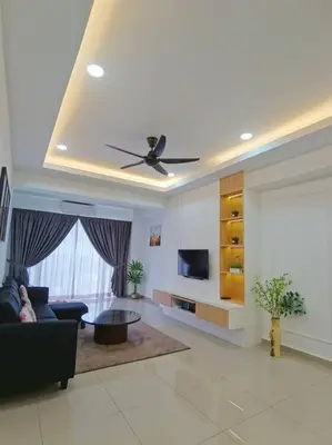 a living room with a couch and a ceiling fan at 5D Homestay in Sitiawan