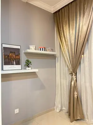 a room with a curtain and a shelf with a window at Art Homestay 4 Bedrooms House by Mr Homestay in Teluk Intan