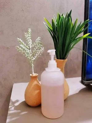 a bottle of soap and two vases on a table at [NEW LAUNCH] SUNRISE GURNEY SEAVIEW'63 无敌日出海景63 in George Town