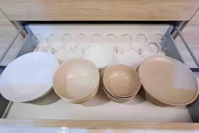 a group of dishes and glasses in a drawer at [NEW LAUNCH] SUNRISE GURNEY SEAVIEW'63 无敌日出海景63 in George Town