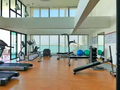 a gym with a lot of treadmills and exercise equipment at [NEW LAUNCH] SUNRISE GURNEY SEAVIEW'63 无敌日出海景63 in George Town