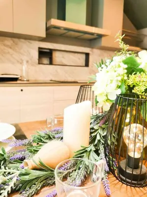 a table with a candle and flowers on it at [NEW LAUNCH] SUNRISE GURNEY SEAVIEW'63 无敌日出海景63 in George Town
