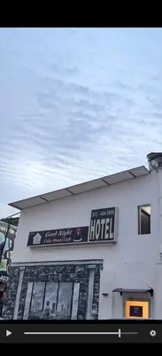 a building with a sign for a hotel at Goodnight Homestay in George Town