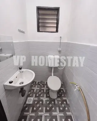 a bathroom with a toilet and a sink at VP Homestay - Malay Only in Ipoh