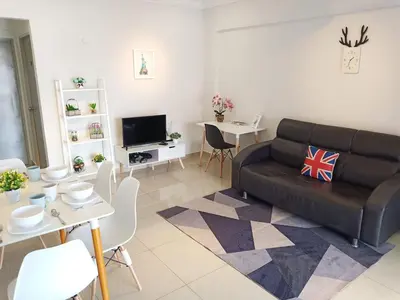 a living room with a couch and a table at Georgetown, Up to 6 Pax, 3 Bedrooms, 1 Car Park by Star Home in Jelutong